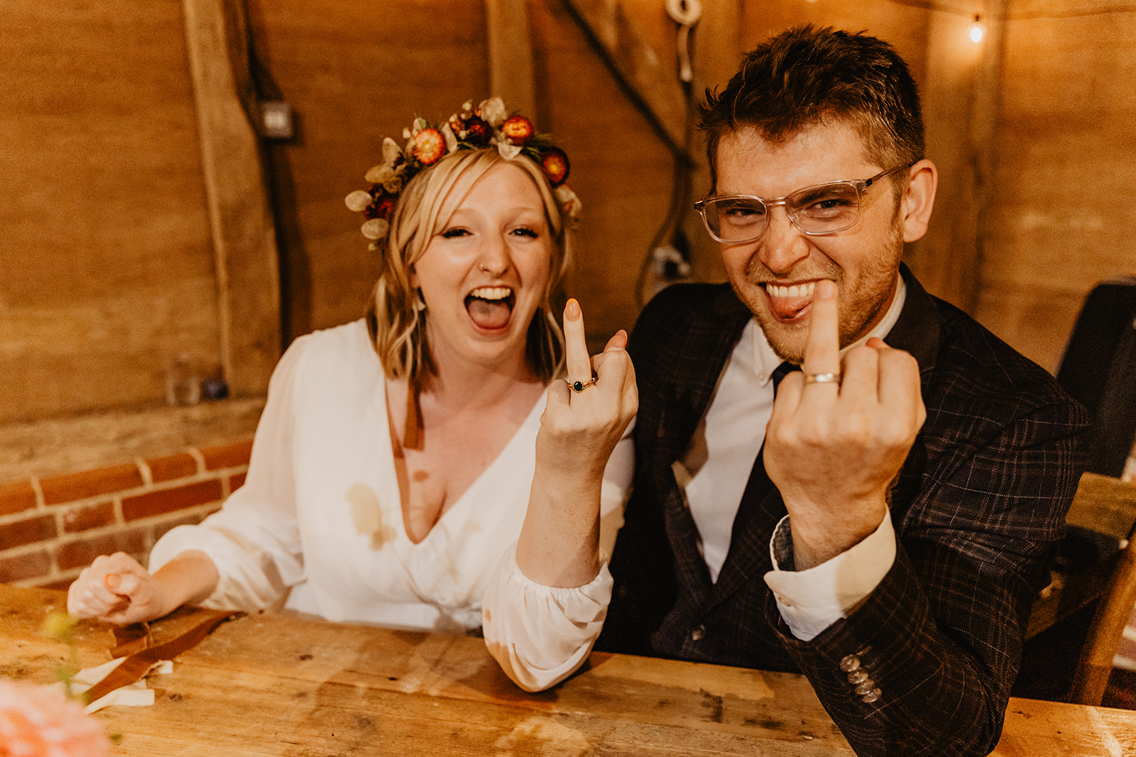 Bride and groom showing off their rings at a wedding at Gilbert White's Hampshire. By OliveJoy Photography.
