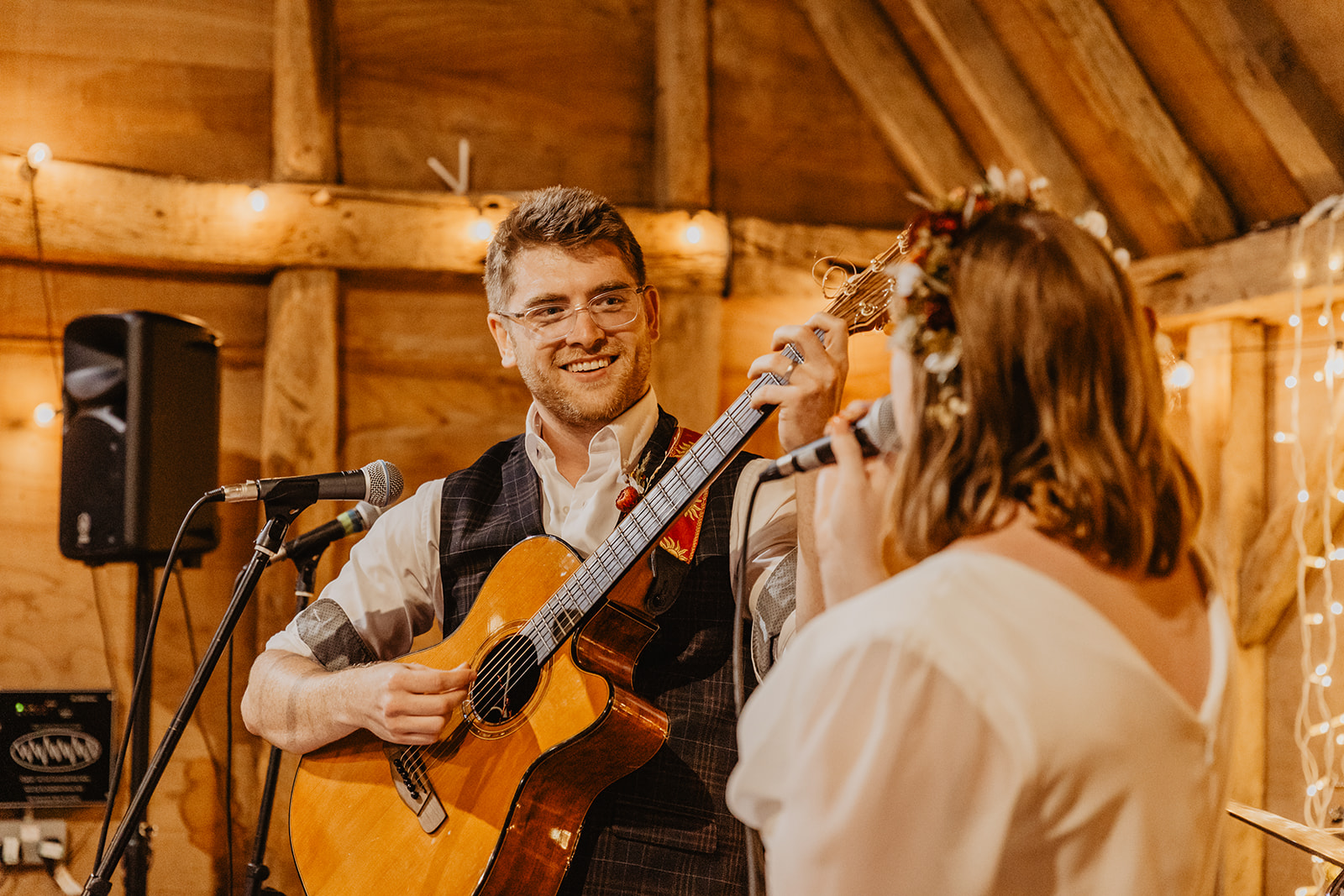 Bride and Groom singing to each other at a wedding at Gilbert White's Hampshire. By OliveJoy Photography.