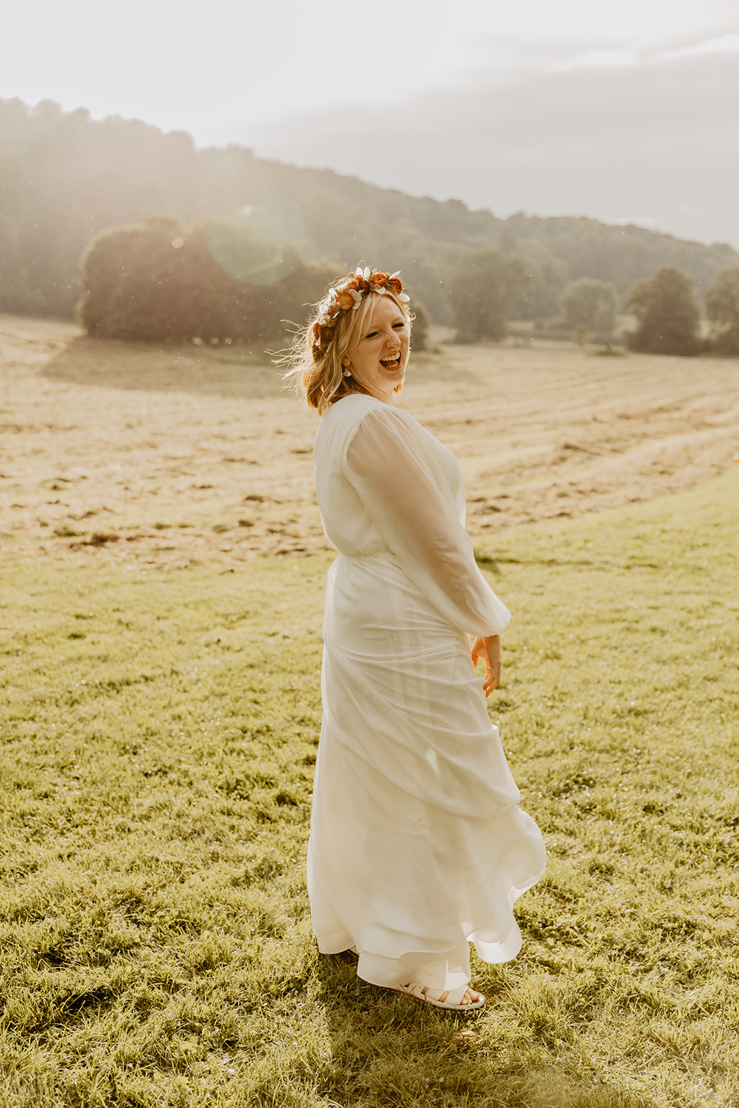 Bride at sunset at a wedding at Gilbert White's Hampshire. By OliveJoy Photography.