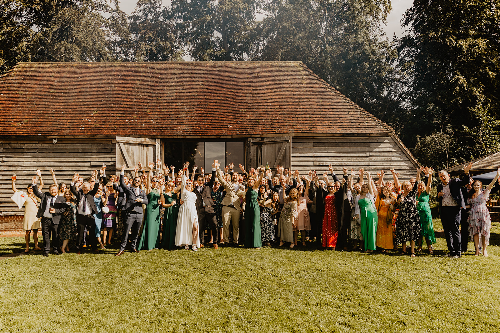 Wedding guests group photo at a wedding at Gilbert White's Hampshire. By OliveJoy Photography.