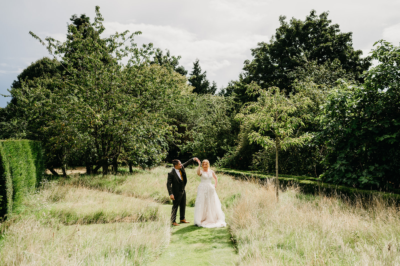 shropshire couple dance in the gardens of pimhill barn 