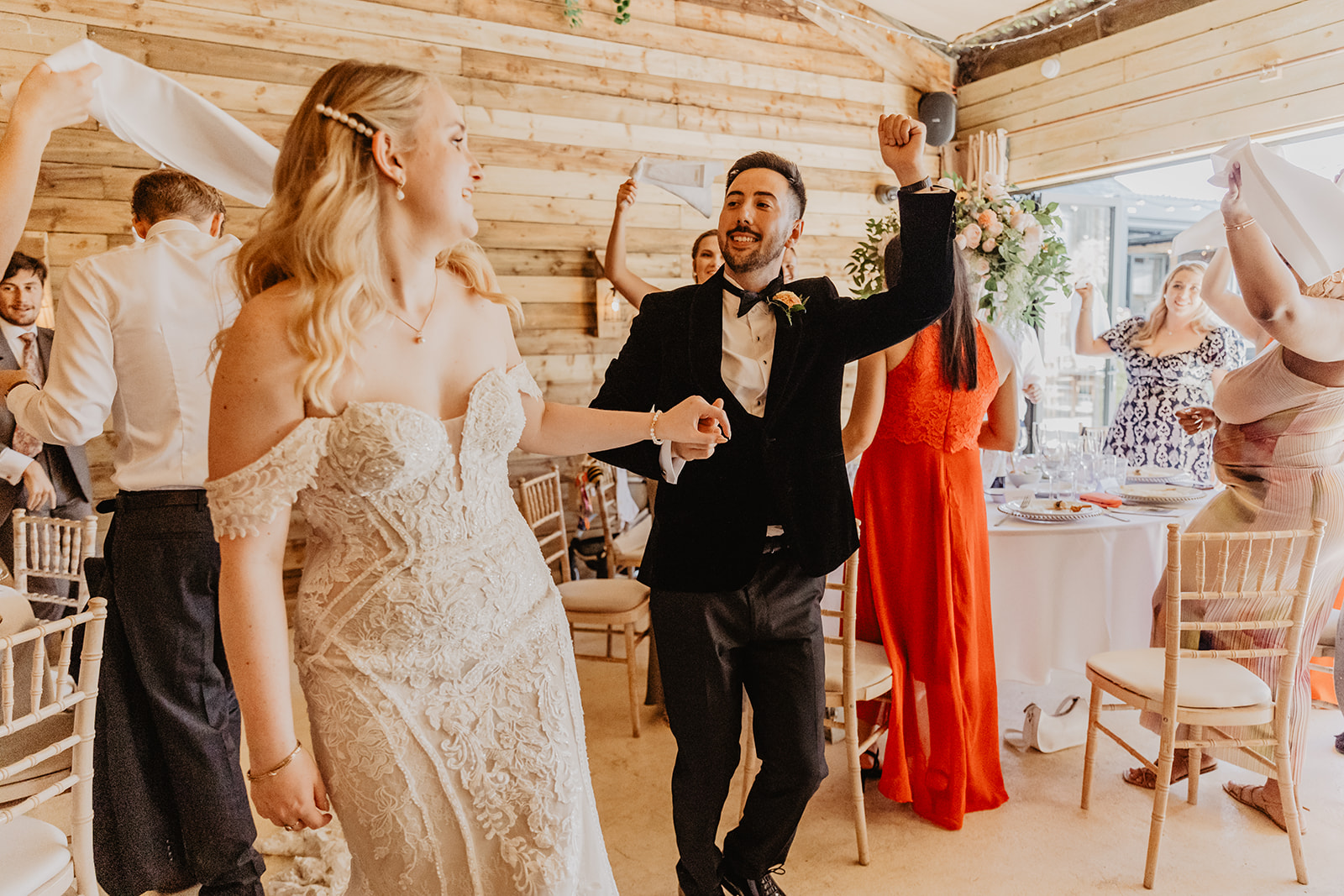 Bride and groom arriving at reception at a Southlands barn wedding, Sussex. Photo by OliveJoy Photography.