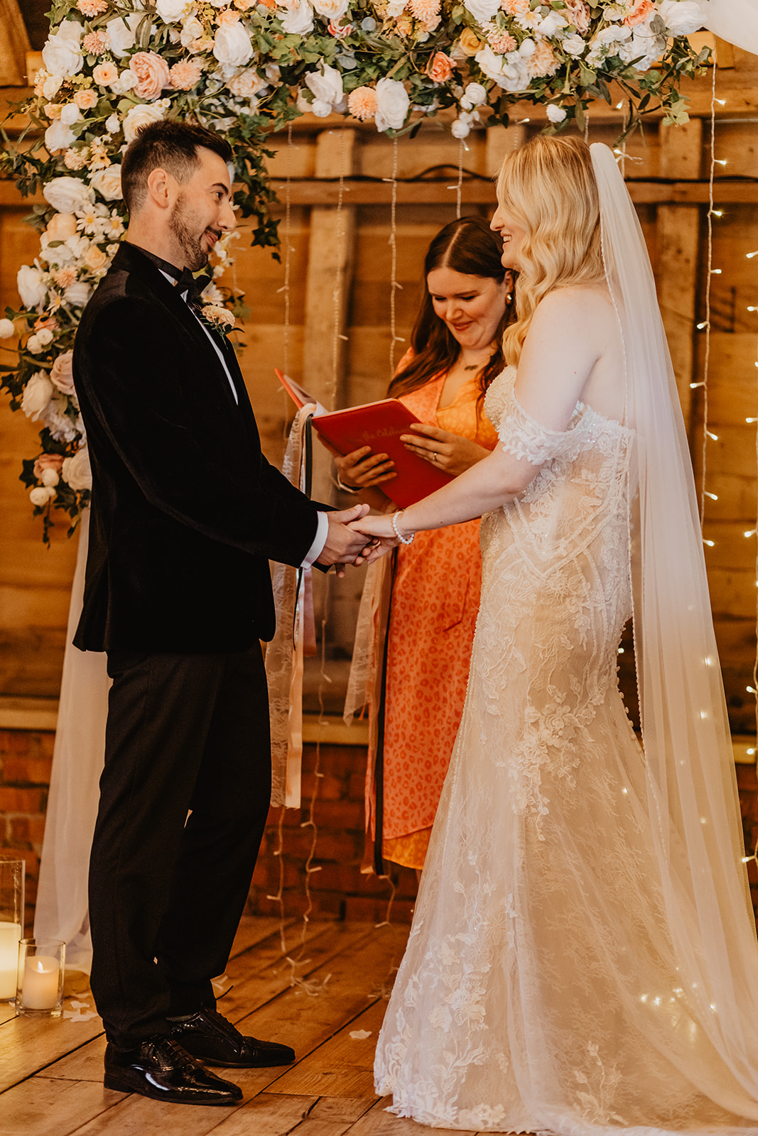 Bride and groom exchange vows at a Southlands barn wedding, Sussex. Photo by OliveJoy Photography.