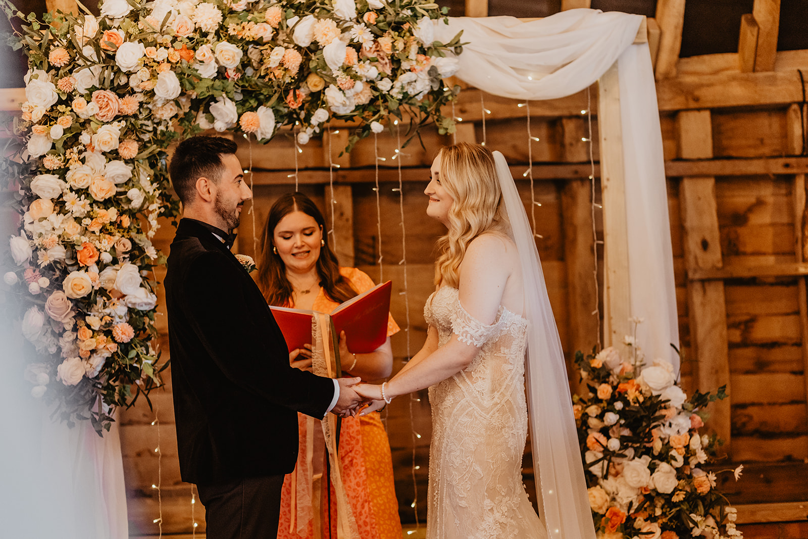 Bride and groom exchange vows at a Southlands barn wedding, Sussex. Photo by OliveJoy Photography.