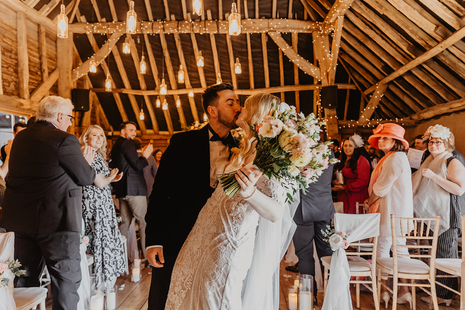 Bride and groom walk down the aisle at a Southlands barn wedding, Sussex. Photo by OliveJoy Photography.