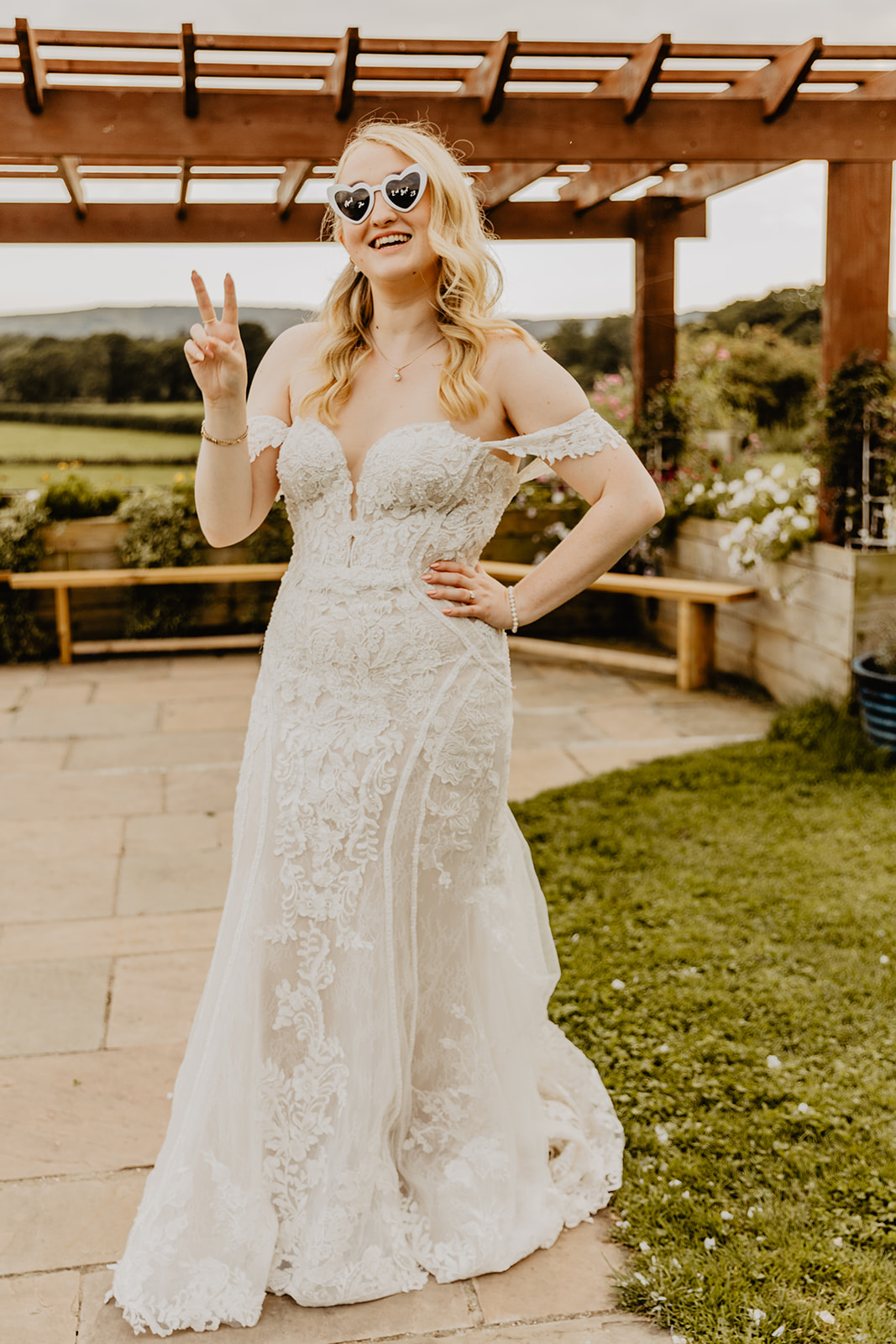 Bride with sunglasses at a Southlands barn wedding, Sussex. Photo by OliveJoy Photography.
