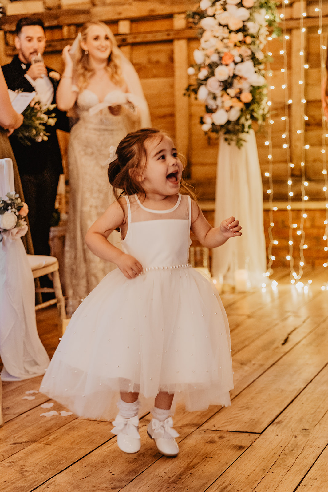 happy child at a Southlands barn wedding, Sussex. Photo by OliveJoy Photography.