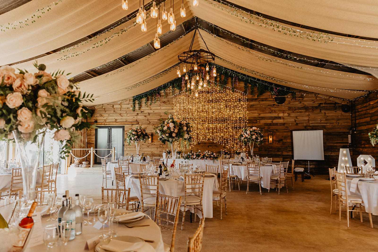 Wedding reception room at a Southlands barn wedding, Sussex. Photo by OliveJoy Photography.