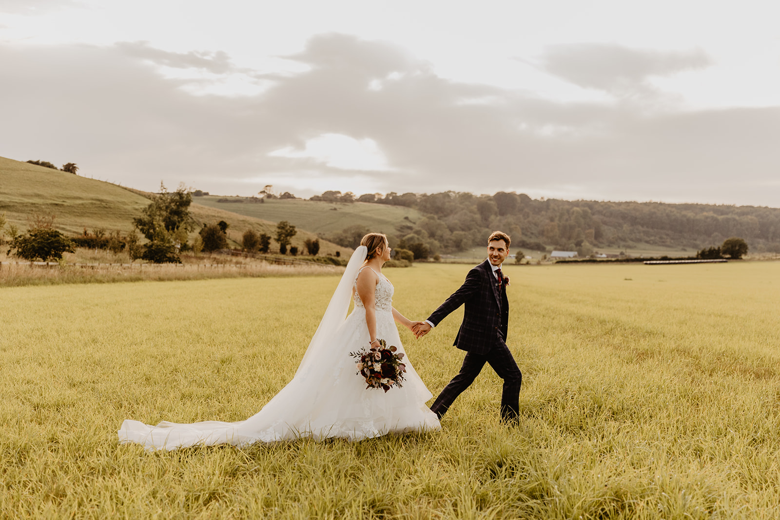 Bride and groom at sunset at a wedding at Long Furlong Barn, Sussex. By OliveJoy Photography