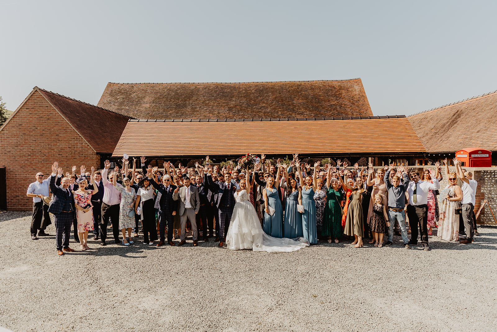 Wedding guests group photo at a wedding at Long Furlong Barn, Sussex. By OliveJoy Photography.