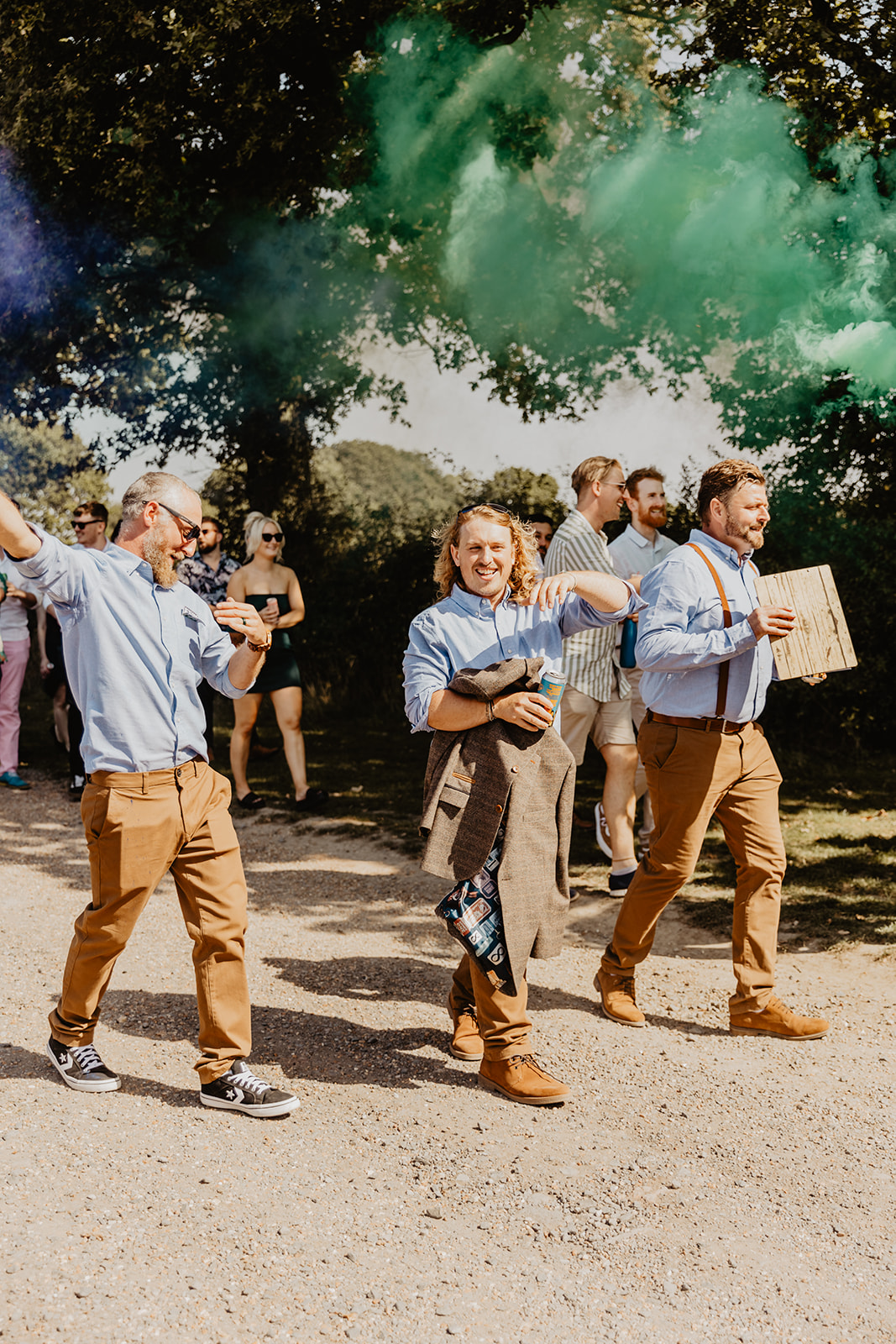 Brass marching band procession at a wedding at Mac's Farm in Sussex. By OliveJoy Photography.