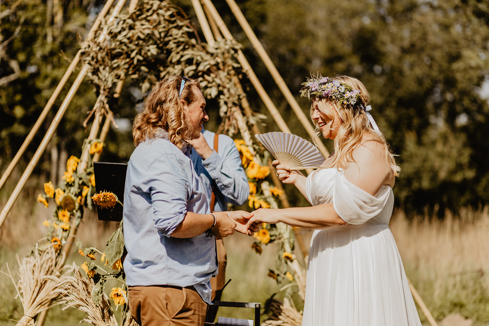 Bride and Groom exchanging vows at a wedding at Mac's Farm in Sussex. By OliveJoy Photography.