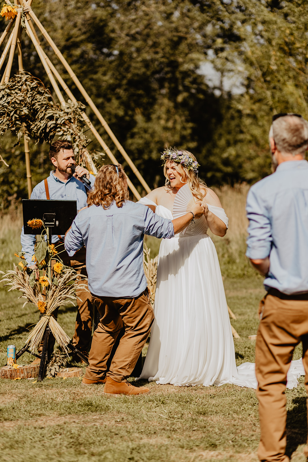 Bride and Groom exchanging vows at a wedding at Mac's Farm in Sussex. By OliveJoy Photography.
