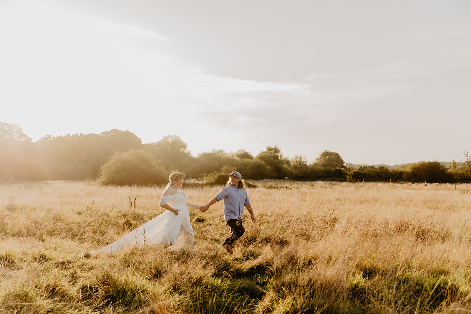 Bride and groom at sunset at a wedding at Mac's Farm in Sussex. By OliveJoy Photography.