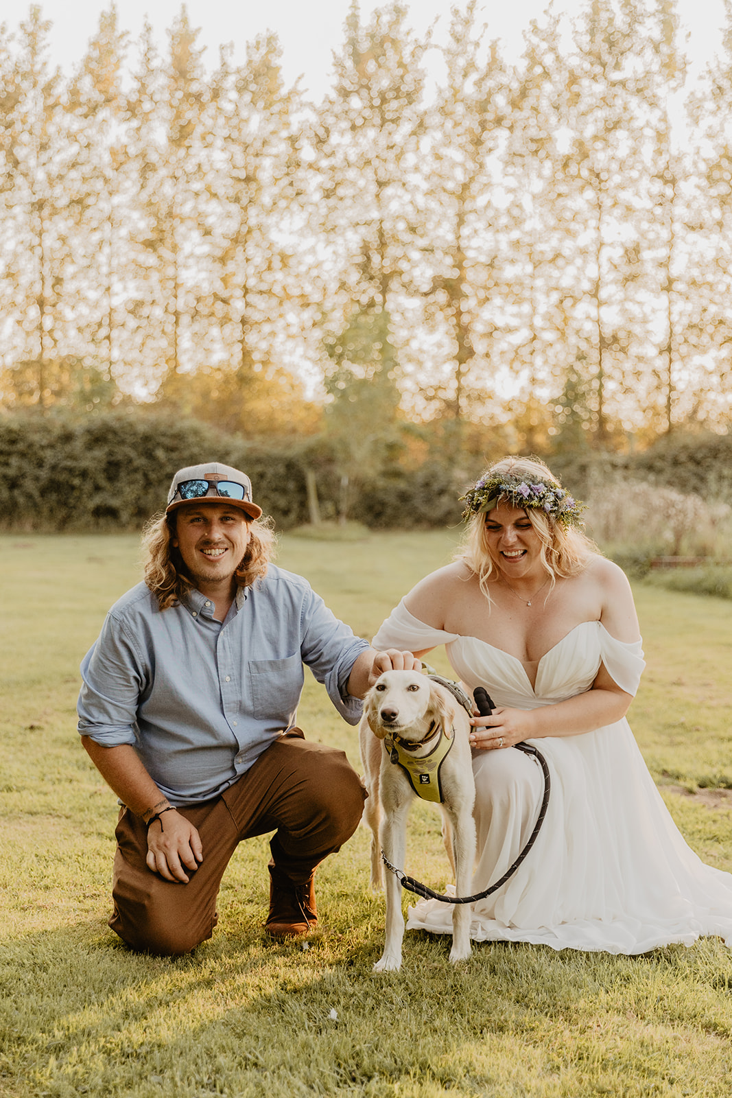 Bride and groom with their dog at a wedding at Mac's Farm in Sussex. By OliveJoy Photography.