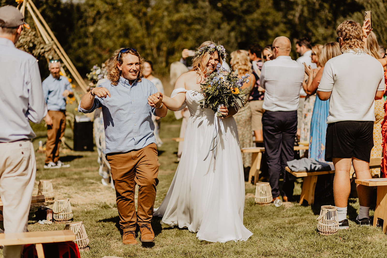Bride and Groom walking down the aisle at a wedding at Mac's Farm in Sussex. By OliveJoy Photography.