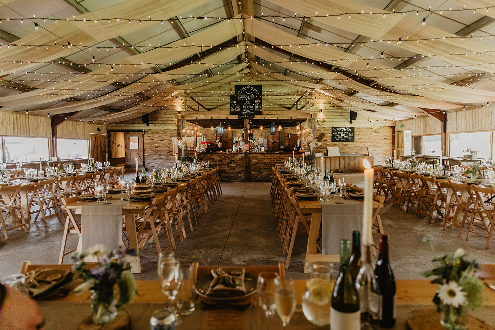 Wedding reception barn at a wedding at Mac's Farm in Sussex. By OliveJoy Photography.