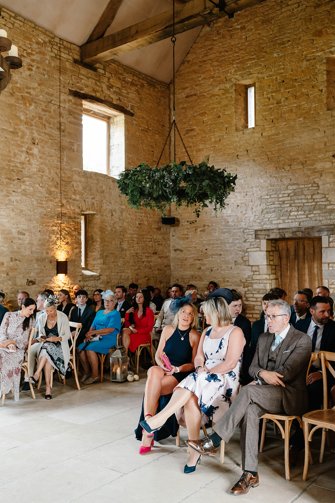 guests seated at the ceremony at Yard Space Old Gore wedding venue in the Cotswolds