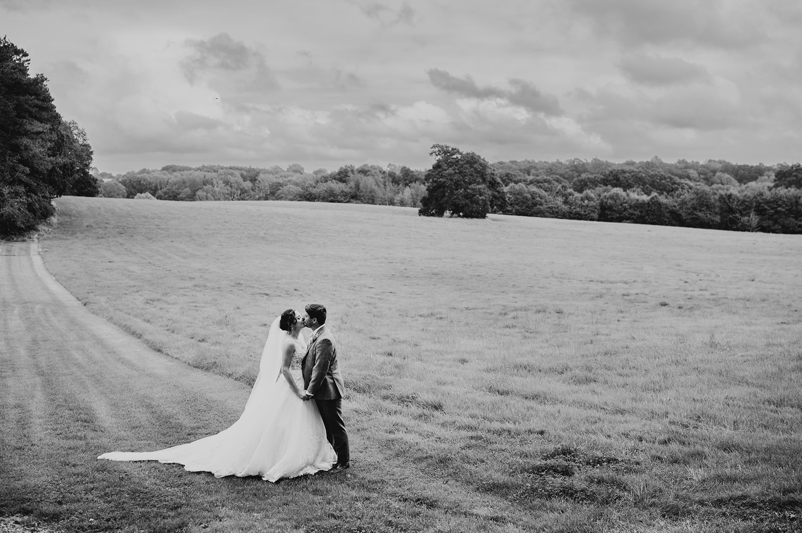 A couple kiss outside Holywell estate in hampshire