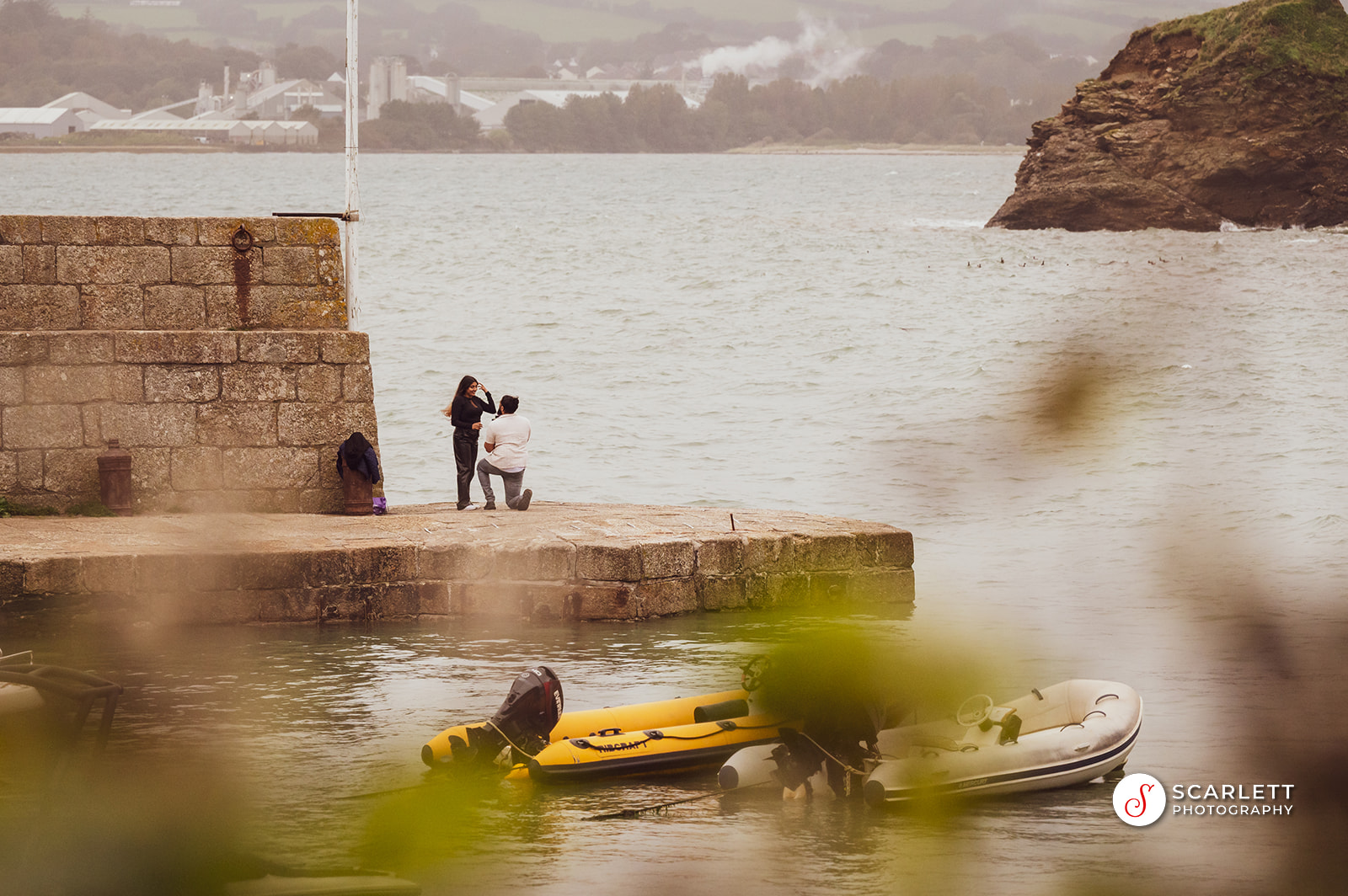 A man proposes on the pier at Polkerris Beach