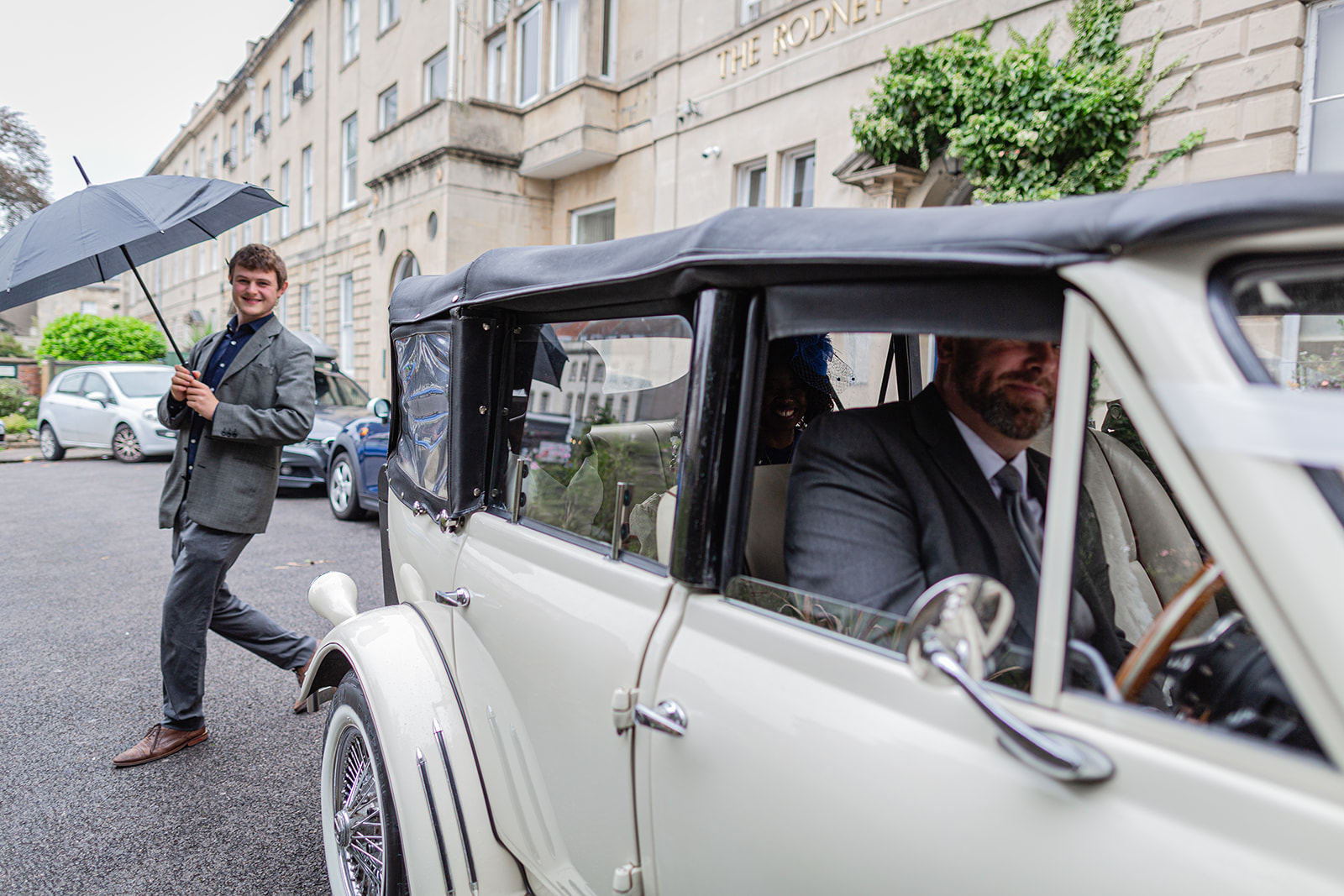 Bride arrives in old classic wedding car.