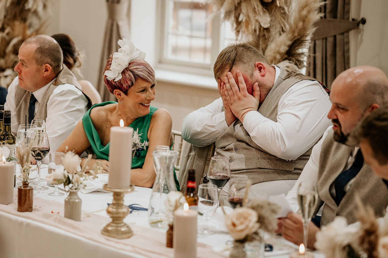 laughing guests at white hart wedding