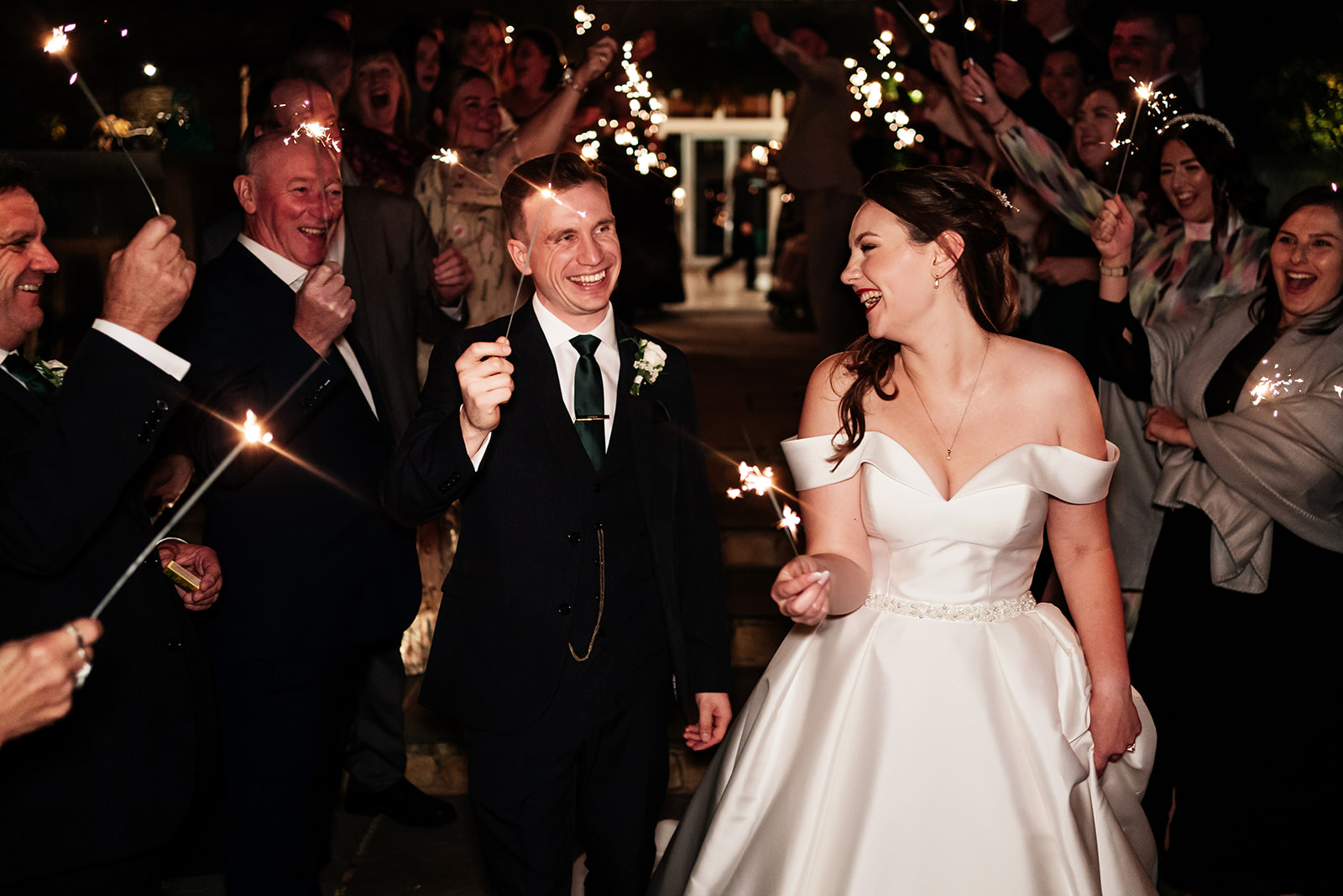 Bride and groom during sparkler exit 