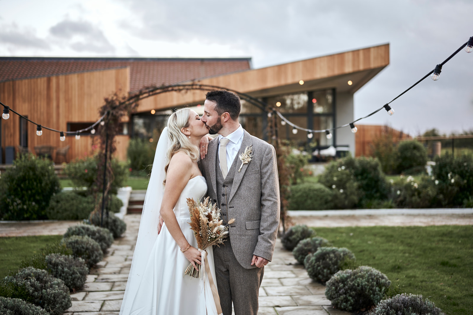 Little Green Wedding Barn Couple Kissing- Rachel Reeve Photography