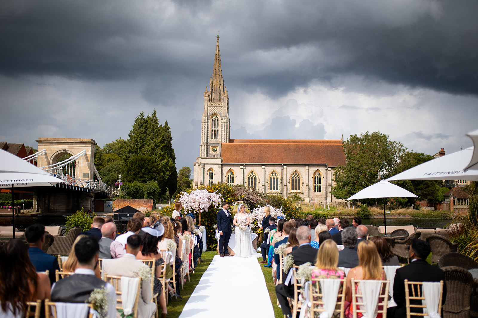 wedding ceremony on the river thames overlooking marlow church