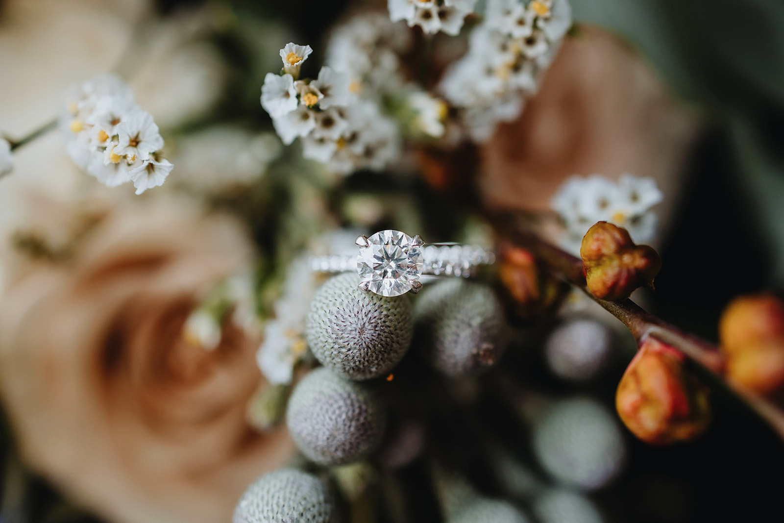 Details of a colorful wedding bouquet and close-ups of an engagement ring