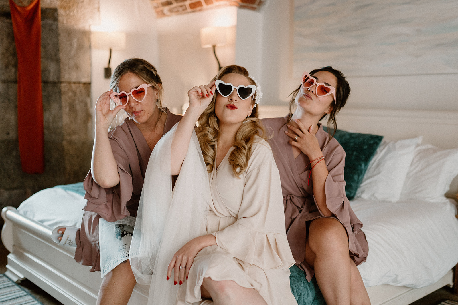 Bride and bridesmaids pose with sunglasses