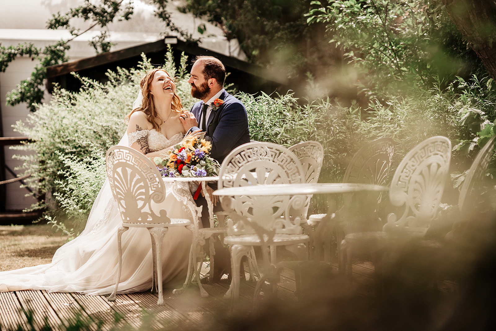 bride and groom in garden at Mill house hotel