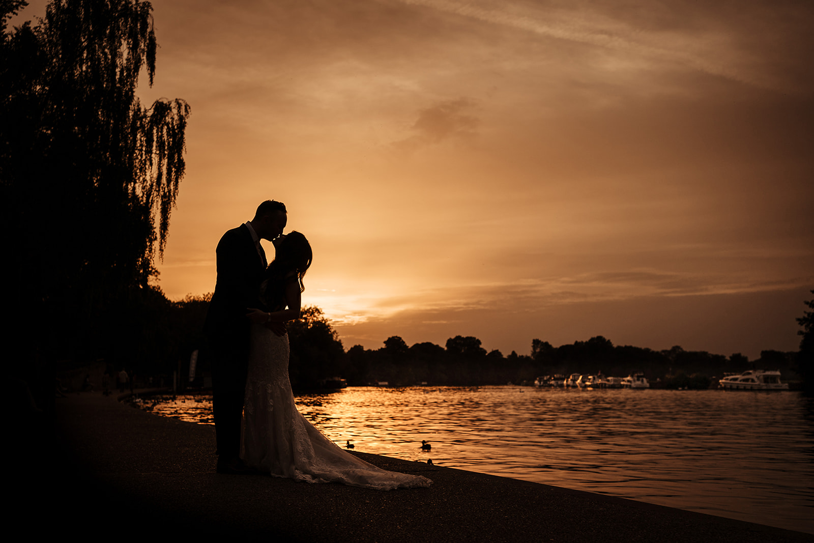 bride and groom sunset by the river thames in windsor