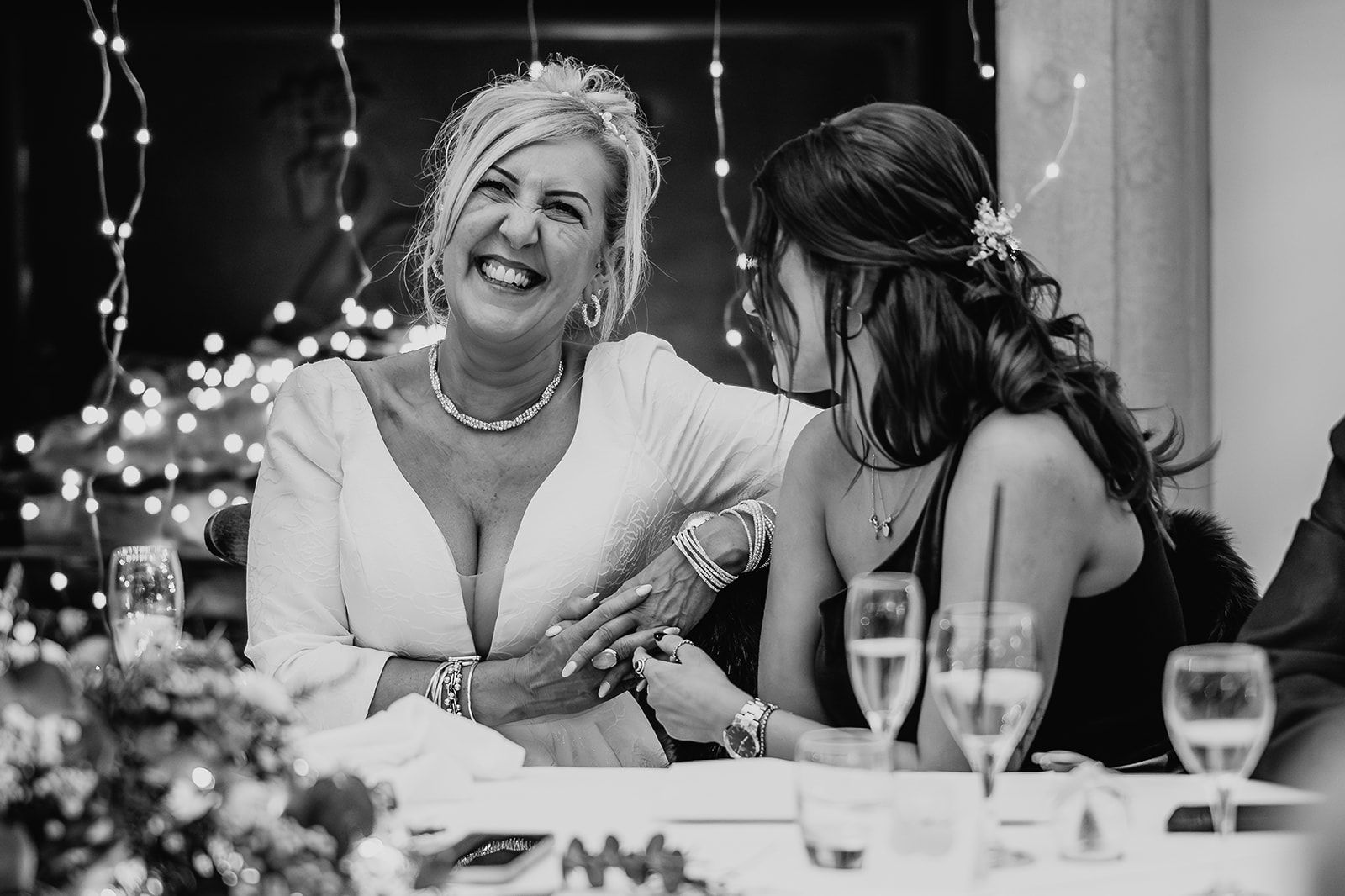 bride and daughter laughing on wedding day