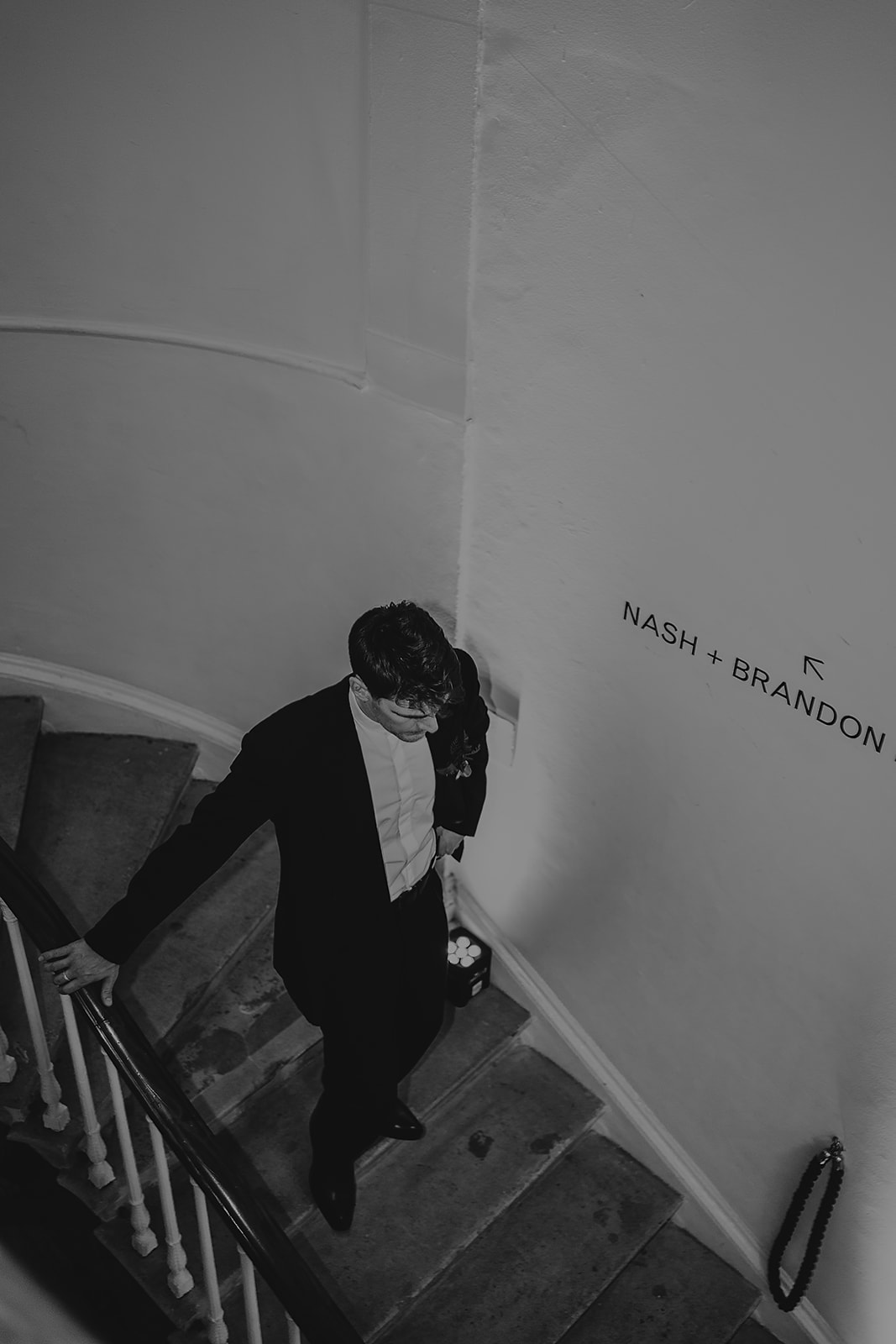 groom walking down stairs at ICA London wedding