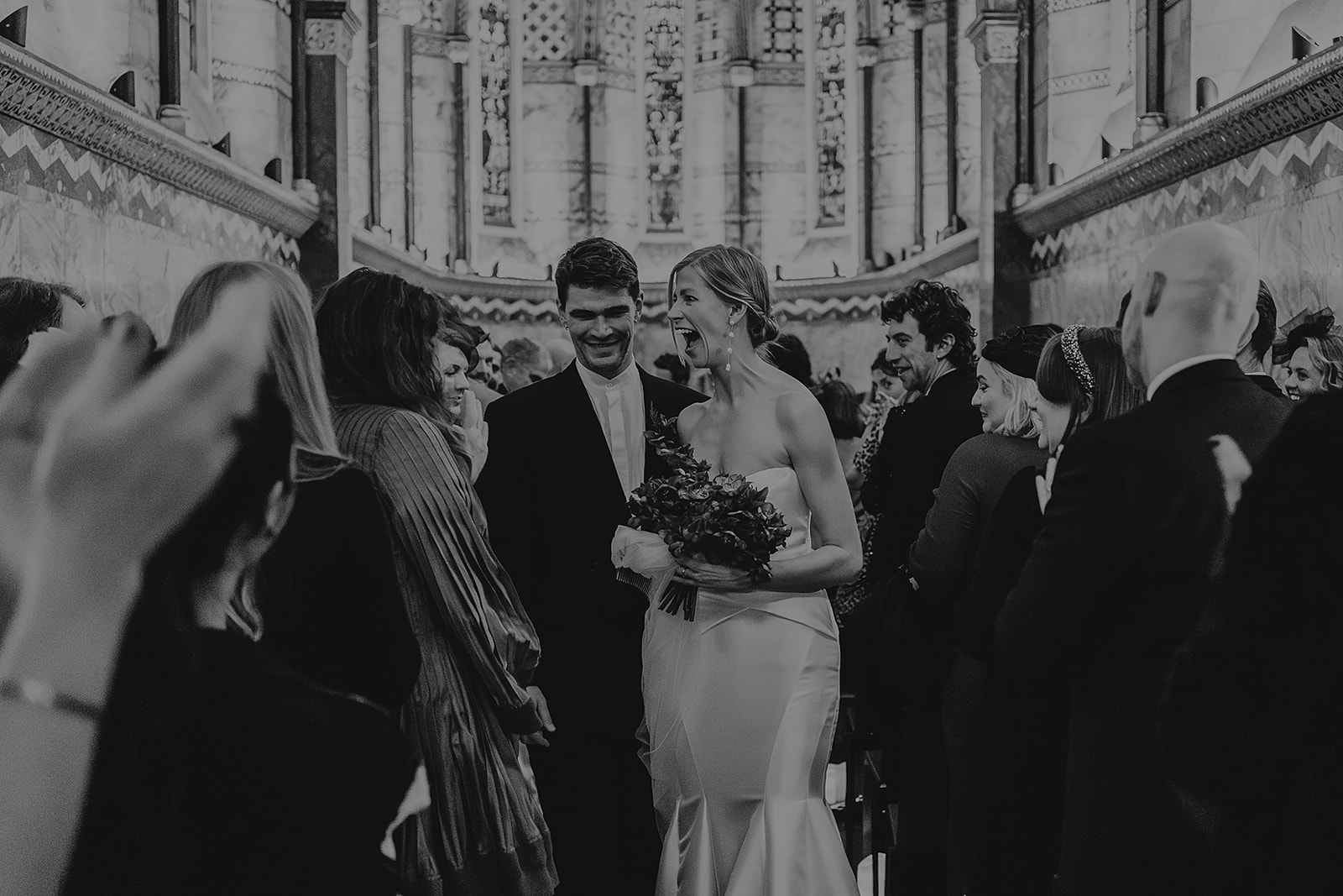 Married couple walking down the aisle at Fitzrovia Chapel