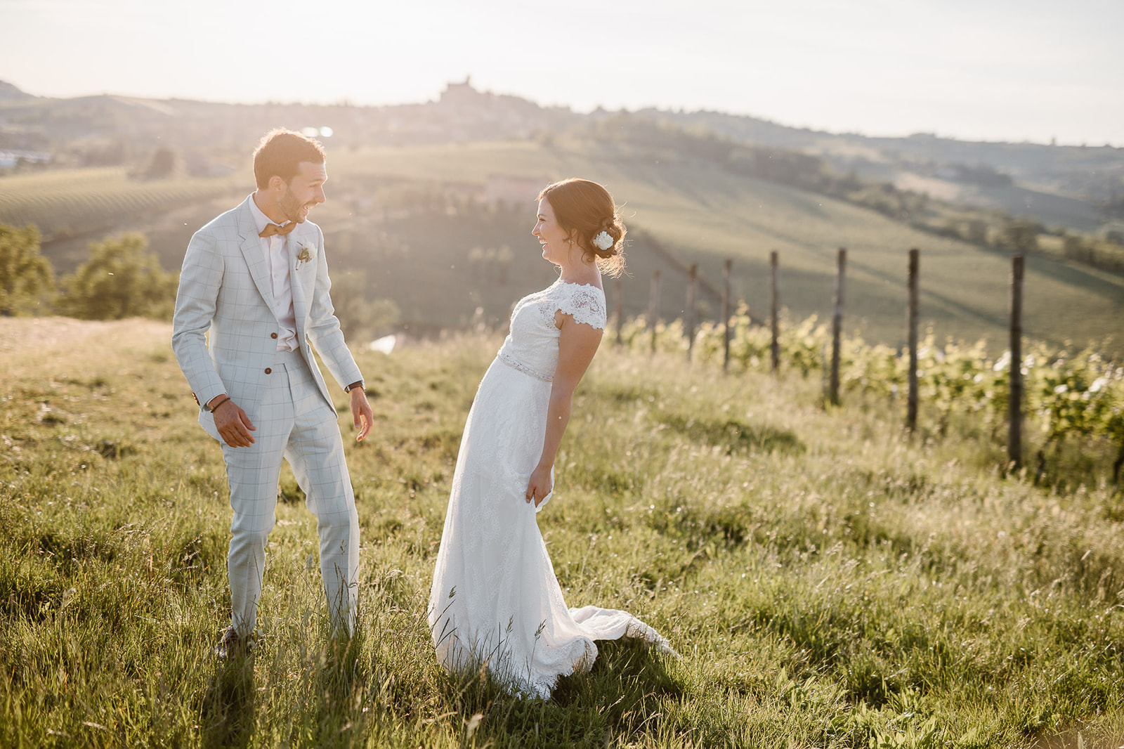bride and groom in the vineyards of the Italian countryside in Piedmont
