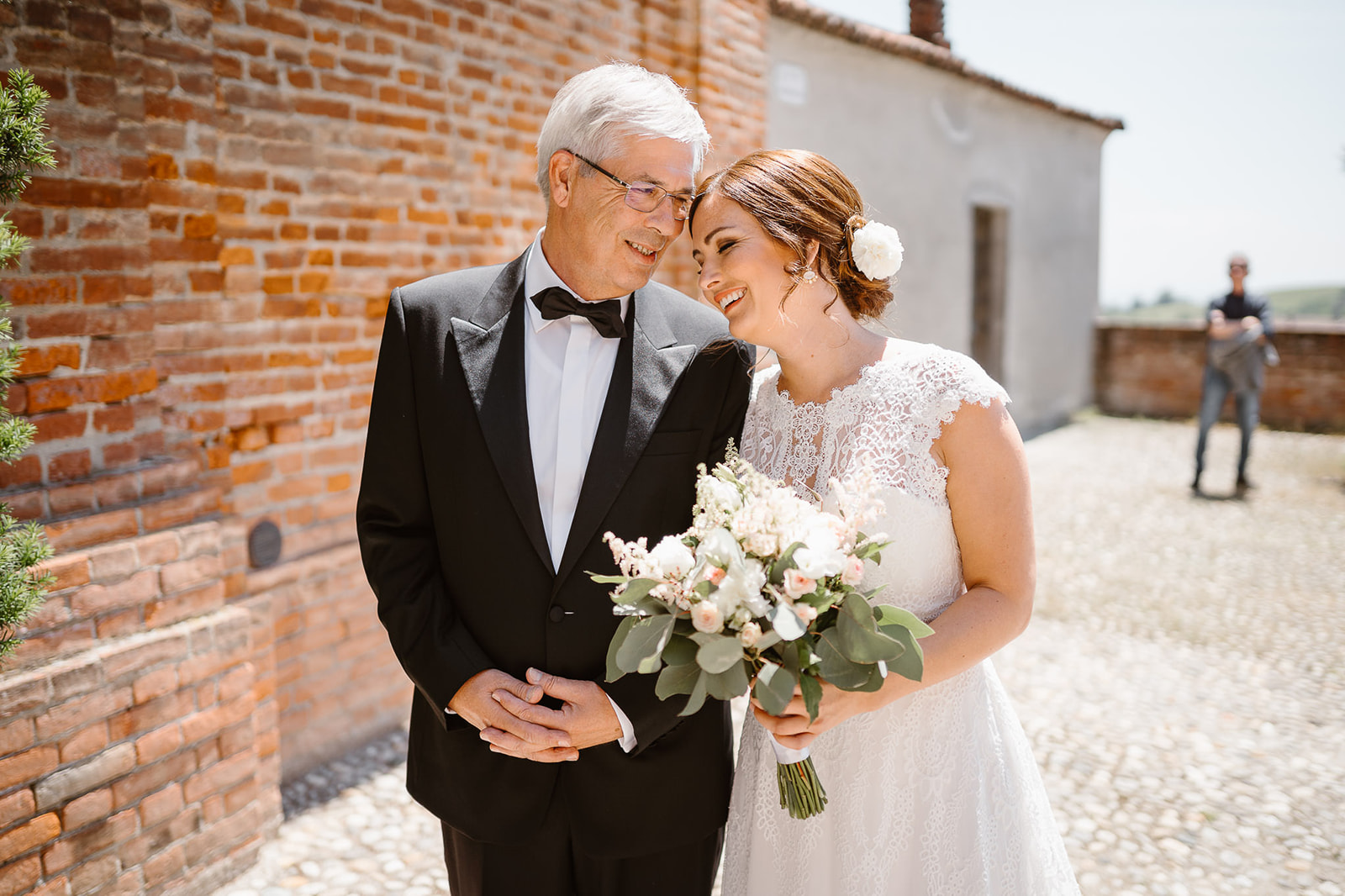 Emotional moments between a bride and her father before entering in Lu Monferrato Church