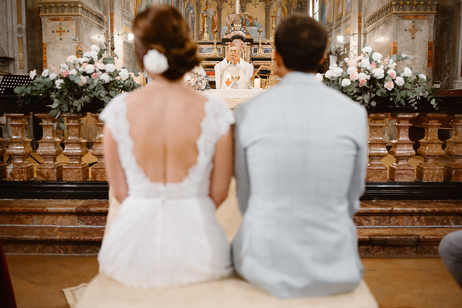Italian priest officiating a wedding ceremony in a Church
