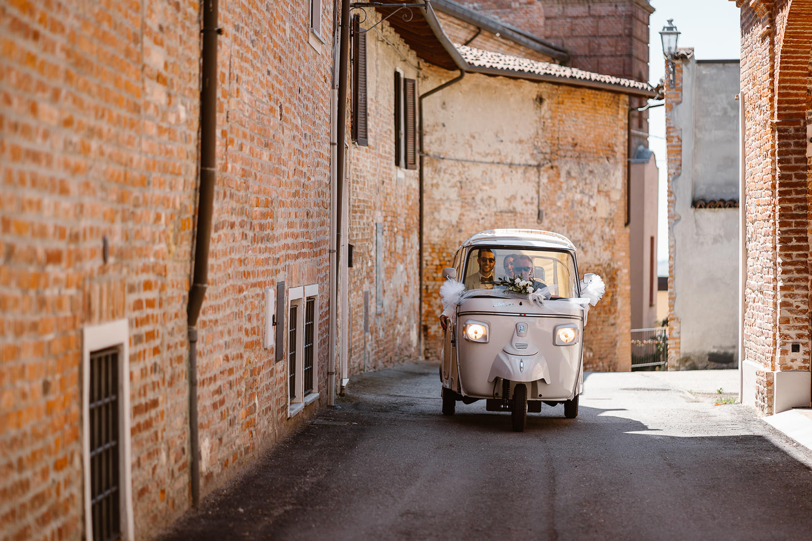 Ape car driving by the small roads of Lu Monferrato, an  old Italian village 