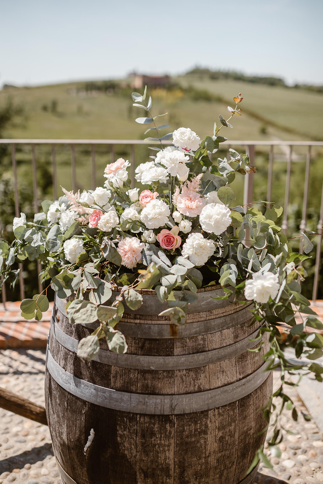 Wine bottle with bohemien flowers as a wedding decor at Cascina Faletta