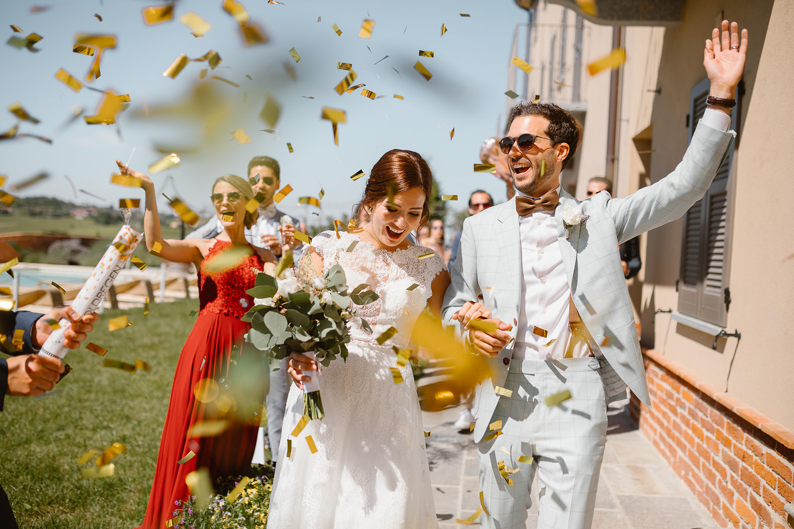 Bride and groom entrance with gold confetti