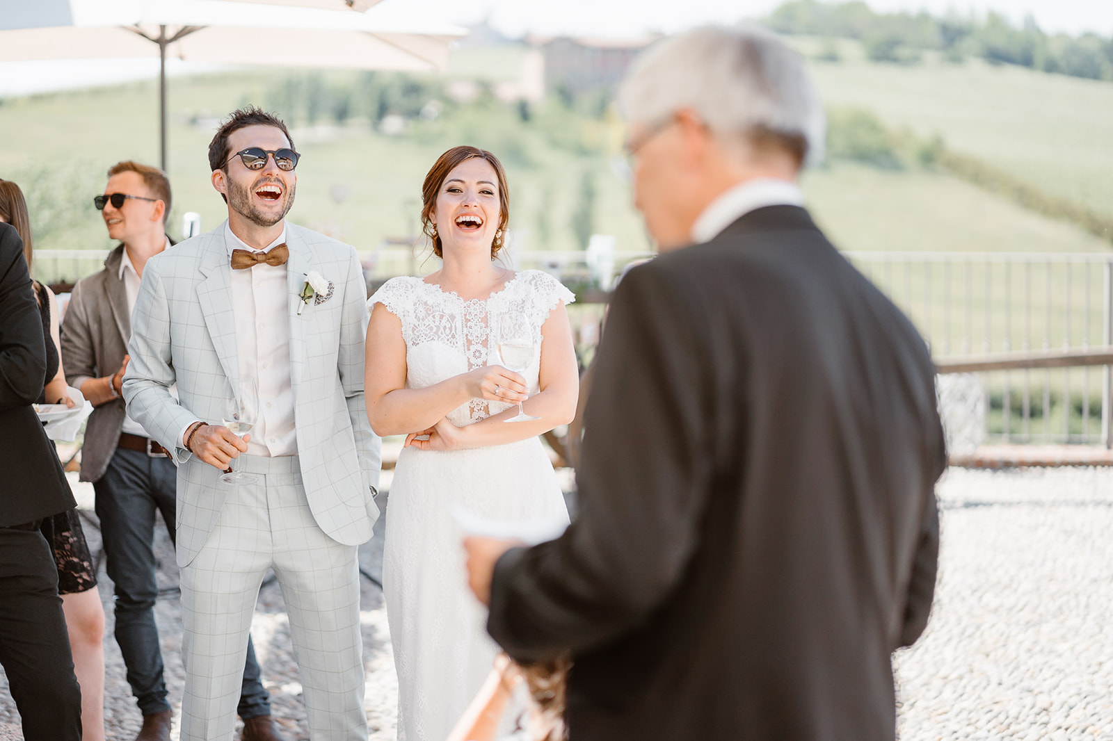 Bride's laughing at father's jokes