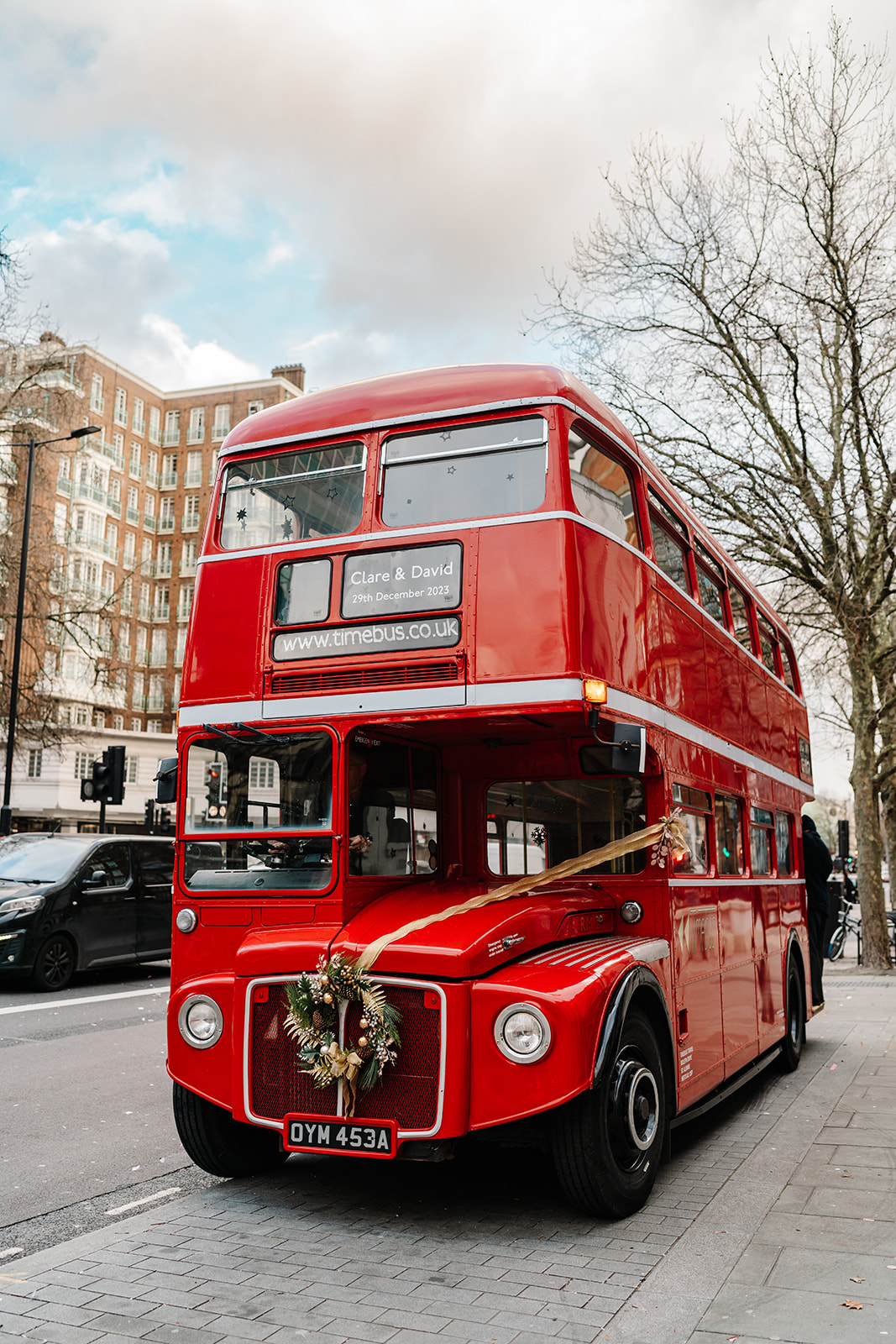 Red London Bus at wedding at Old Marylebone Town Hall | London wedding photographer