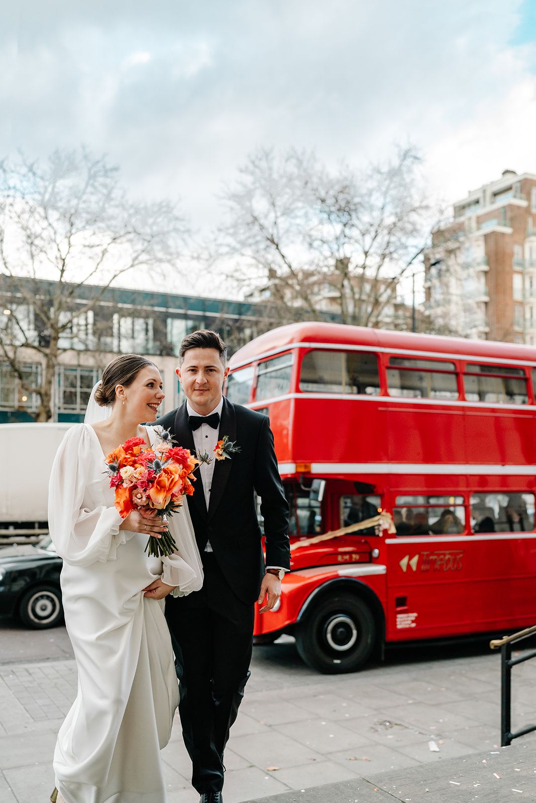 wedding couple with Red London Bus in background at Old Marylebone Town Hall