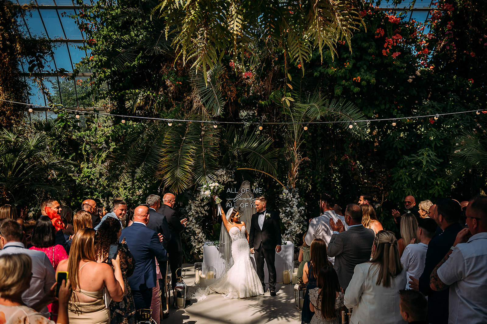 Couple married at the stunning Sefton Palm house.