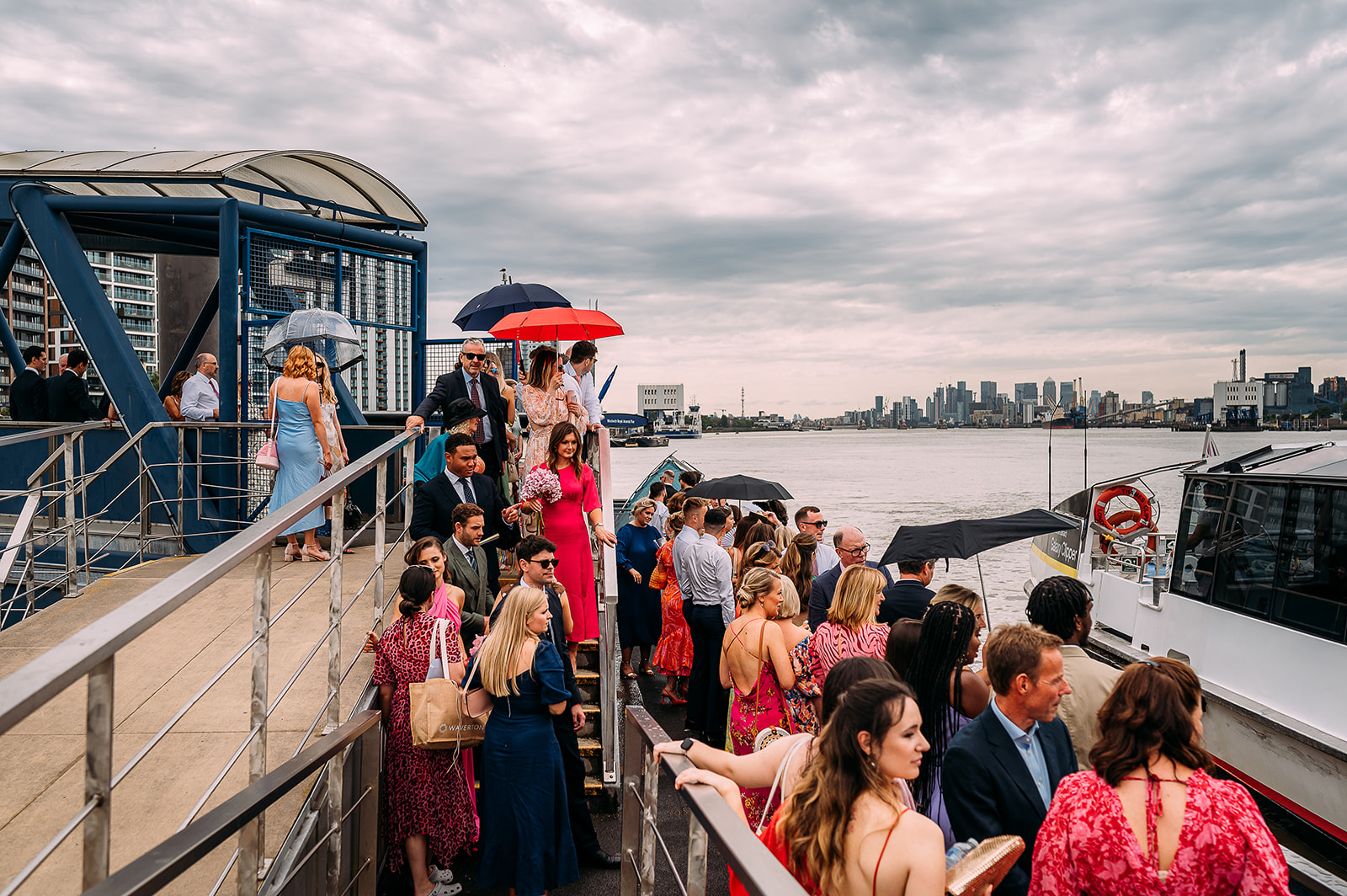 wedding guests boarding their boat on the Thames