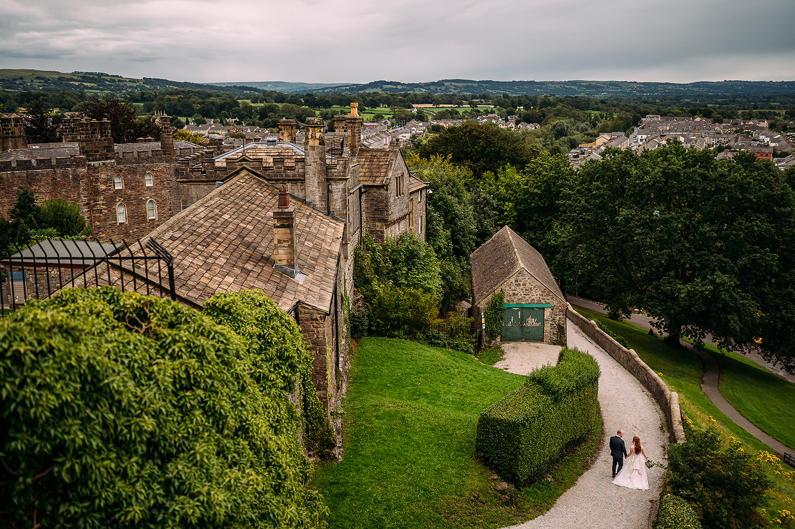 Couple walking down from Clitheroe castle