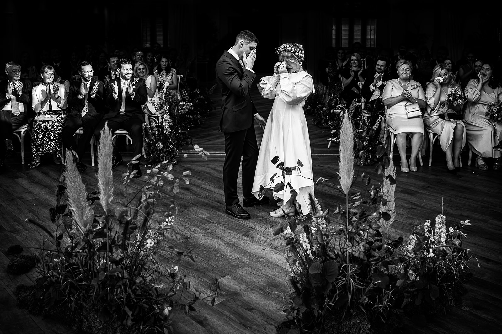 award winning photo of bride and groom both wiping tears during the cermony at Mitton hall