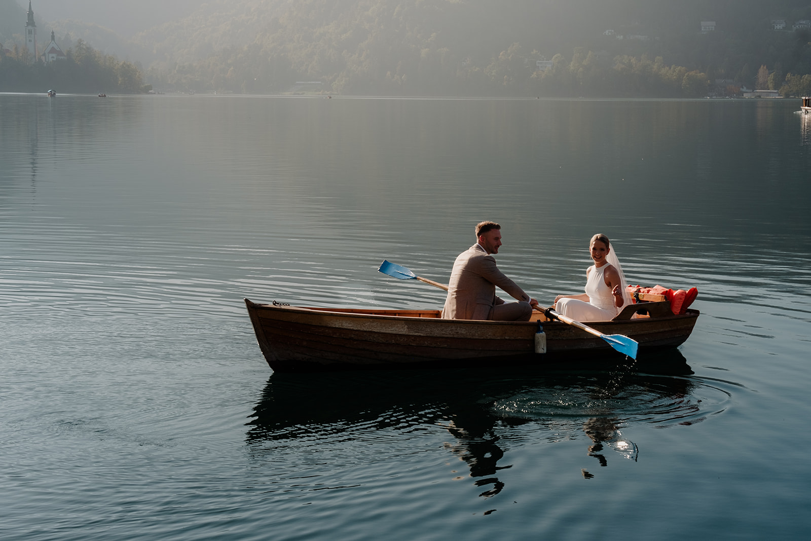 Bride and Groom enjoy a boat trip on Lake Bled